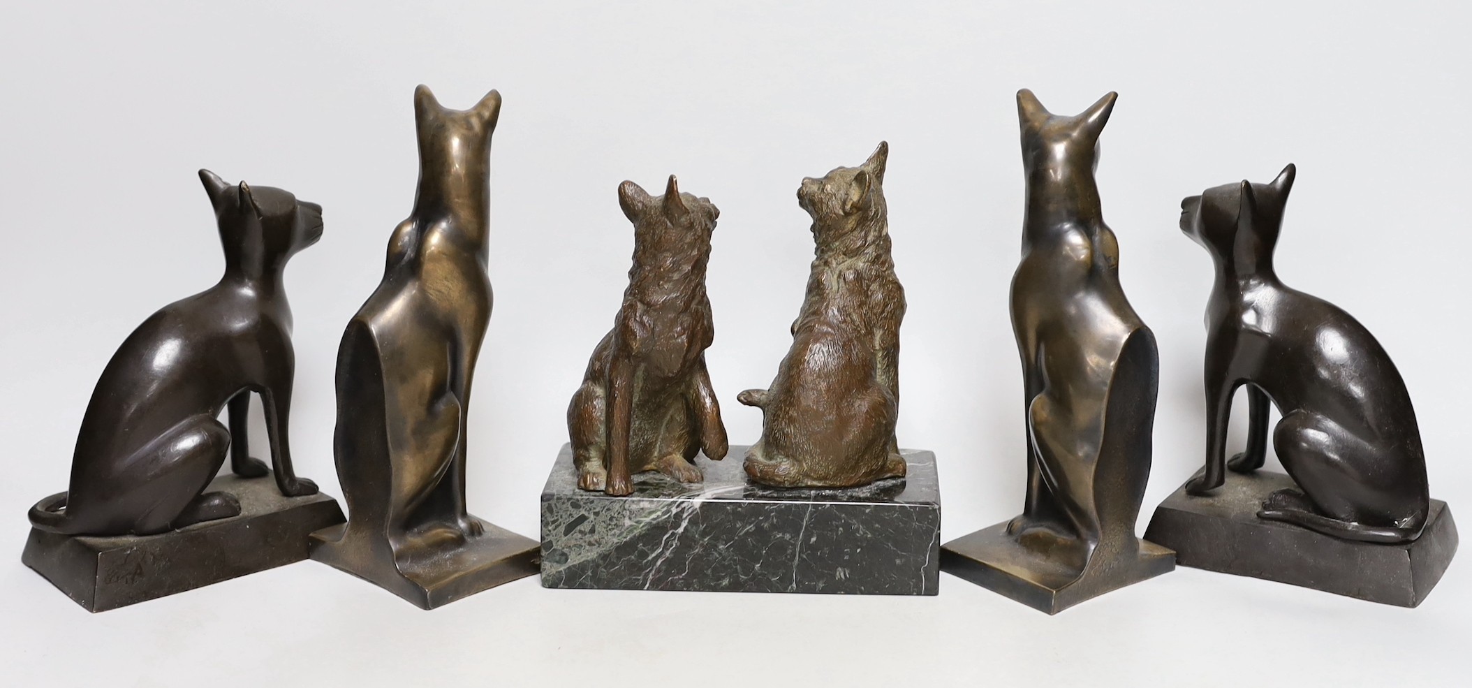 Two bronze cats mounted on a marble base and two pairs of cats (6) tallest 19cms high